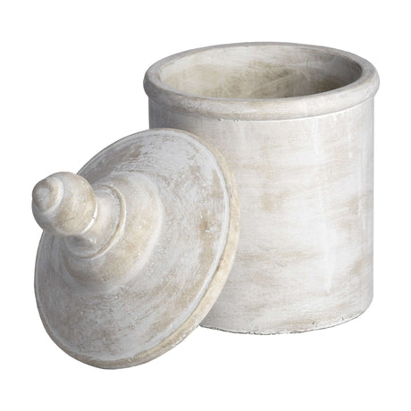 Hill Interiors large lidded stone jar in antique white with a domed finial lid set beside the cylindrical base on a plain white background.