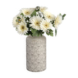 Hill Interiors medium vase in textured grey ceramic-look finish with floral relief pattern, holding a bouquet of cream gerbera daisies and green foliage.