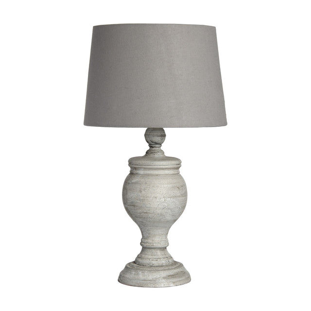 Hill Interiors Wooden Table Lamp in beige with a turned solid wood urn-shaped base and tapered grey linen shade, shown on a plain white background.
