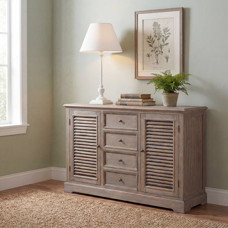 Hill Interiors Slim Wooden Table Lamp in white with tall slender stem and cream tapered shade, styled on a weathered wood sideboard in a sage-green room.
