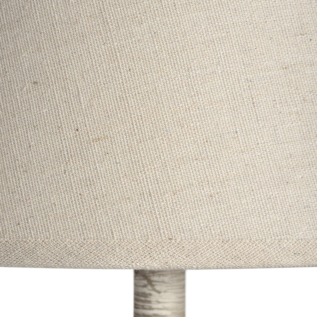 Close-up of the natural linen drum shade and grey turned wood base of the Hill Interiors Wooden Table Lamp.