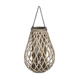 Hill Interiors large bulbous wicker lantern in warm brown, with woven diagonal strands, glass candle insert and grey rope hanger, on a white background.