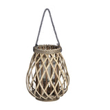 Hill Interiors small bulbous wicker lantern in brown with woven lattice frame, glass candle insert and grey rope handle on a plain white background.