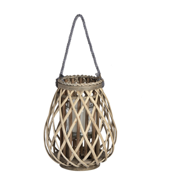 Hill Interiors small bulbous wicker lantern in brown with woven lattice frame, glass candle insert and grey rope handle on a plain white background.