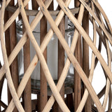 Close-up of the Hill Interiors Small Bulbous Wicker Lantern in brown, showing the woven lattice frame around a clear glass candle insert.