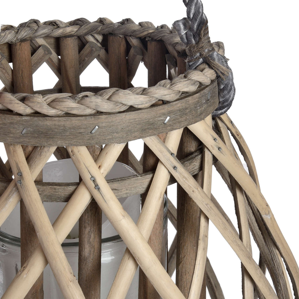 Close-up of Hill Interiors Small Bulbous Wicker Lantern in brown, showing the woven rim, braided trim, glass candle insert and open lattice weave.