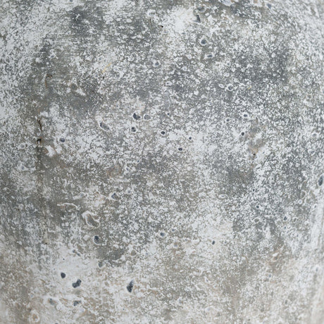 Close-up of the Hill Interiors Aged Stone Ceramic Vase in beige, showing the mottled, matte stone-effect finish with grey and white weathered texture.
