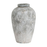 Hill Interiors tall ceramic vase in beige with an aged stone finish, rounded body tapering to a short neck, shown on a plain white background.