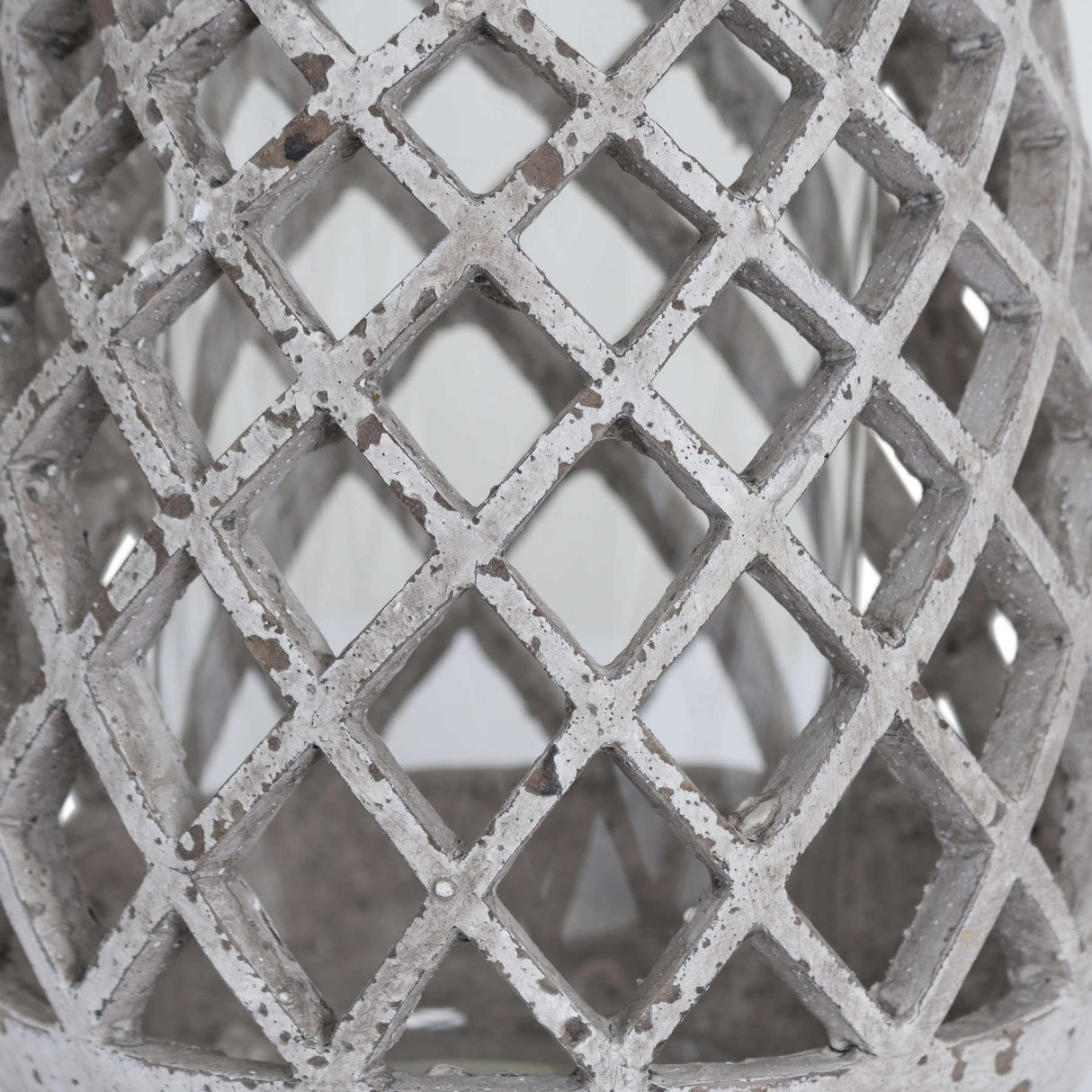 Close-up of Hill Interiors Large Conical Ceramic Lattice Hurricane Lantern in beige, showing the pierced diamond lattice body with a weathered textured finish.