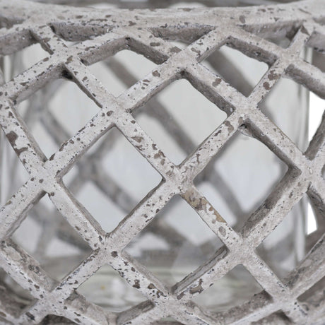 Close-up of the Hill Interiors Round Ceramic Lattice Hurricane Lantern in beige, showing the matte chalky glaze and diamond cut-out lattice pattern.