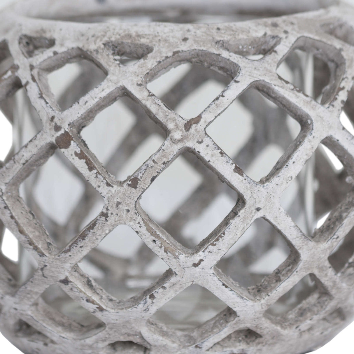 Close-up of the Hill Interiors Large Round Ceramic Lattice Hurricane Lantern in beige, showing the pierced diamond cut-outs and matte textured surface.
