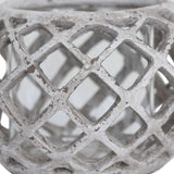 Close-up of the Hill Interiors Large Round Ceramic Lattice Hurricane Lantern in beige, showing the pierced diamond cut-outs and matte textured surface.