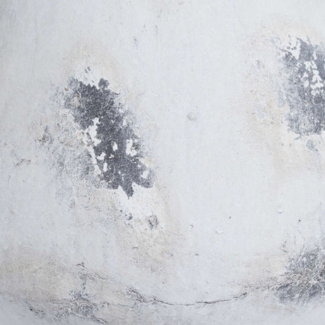 Close-up of the Hill Interiors Large Antique White Ceramic Vase showing its chalky white finish with softly aged grey patches across the curved body.