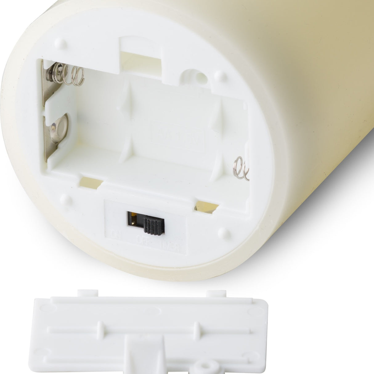 Base of the Hill Interiors LED pillar candle showing the AA battery compartment, on/off/timer switch and removable white cover.