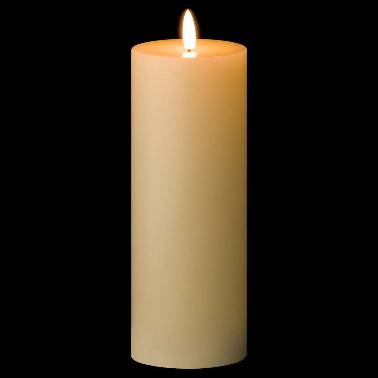Hill Interiors LED cream wax pillar candle from the 20cm set of three, lit with a flickering flame against a black background.