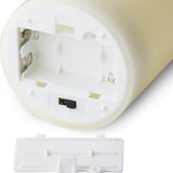 Close-up of the Hill Interiors LED Cream Wax Pillar Candle base showing the AA battery compartment, on/off/timer switch and detached white cover.