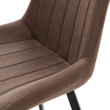 Close-up of the Hill Interiors Draxinby dining chair showing brown faux-leather upholstery with vertical ribbed stitching on the seat and backrest.