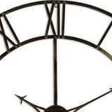 Close-up of Hill Interiors Large Antique Brass Skeleton Wall Clock showing openwork frame, riveted spokes and Roman numeral XII on white.