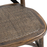 Close-up of the Hill Interiors Cross Back Dining Chair in brown, showing the woven rattan seat and solid timber frame with visible grain.