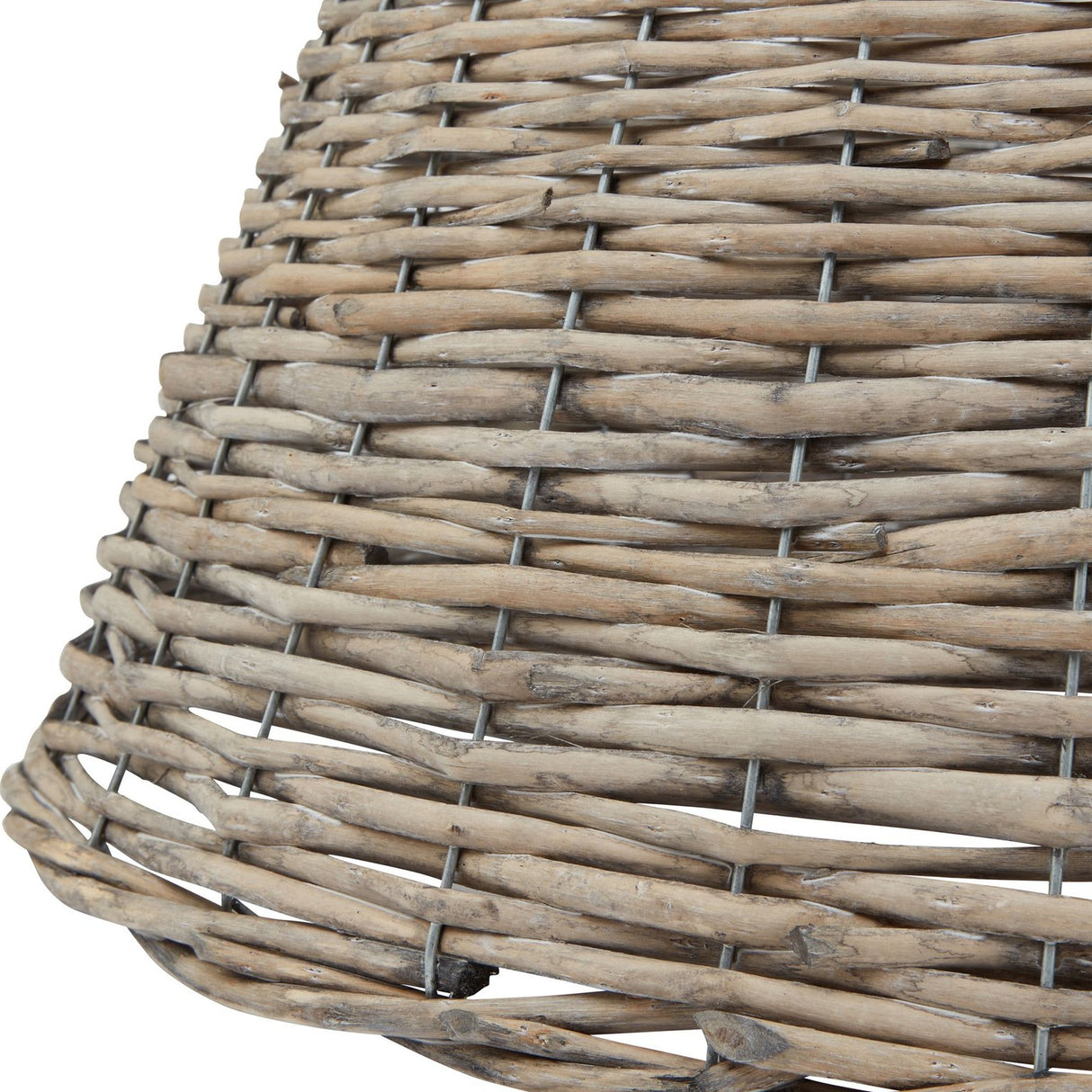 Close-up of the Hill Interiors Wicker Christmas Tree Skirt in brown, showing the hand-woven natural wicker weave and tapered shape.