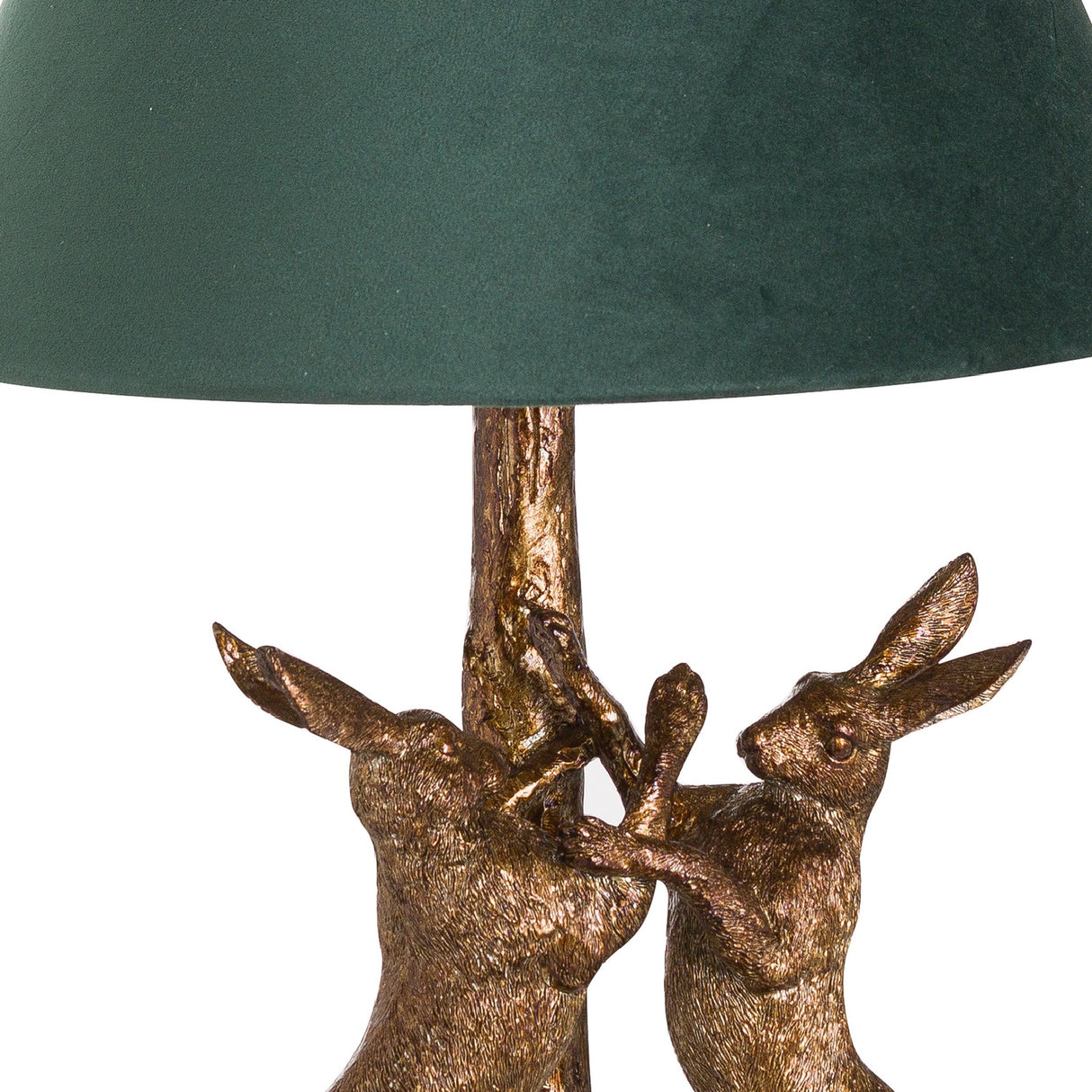 Close-up of Hill Interiors Antique Gold Hares table lamp base, showing two sculpted resin hares in aged gold finish beneath a green velvet shade.