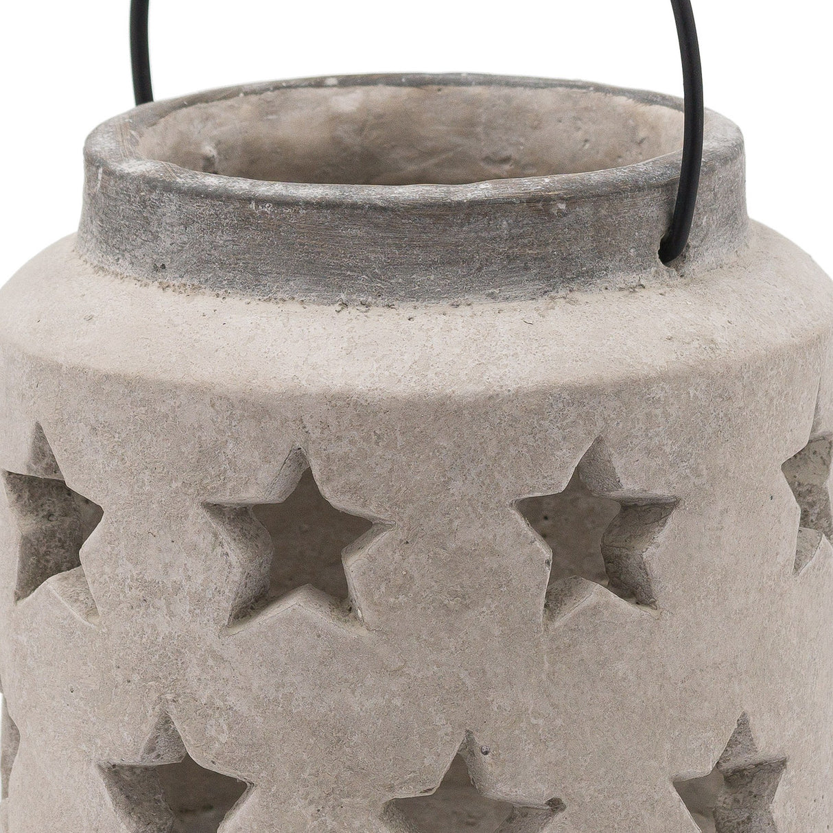 Close-up of Hill Interiors Stone Star Lantern ceramic candle holder in beige, showing the rim, wire handle and cut-out star detailing on the matte body.