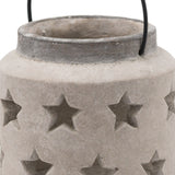 Close-up of Hill Interiors Stone Star Lantern ceramic candle holder in beige, showing the rim, wire handle and cut-out star detailing on the matte body.
