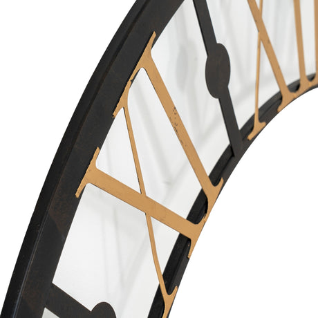 Close-up of Hill Interiors Black and Gold Skeleton Metal Wall Clock 95cm, showing gold Roman numerals and black metal frame against a white background.