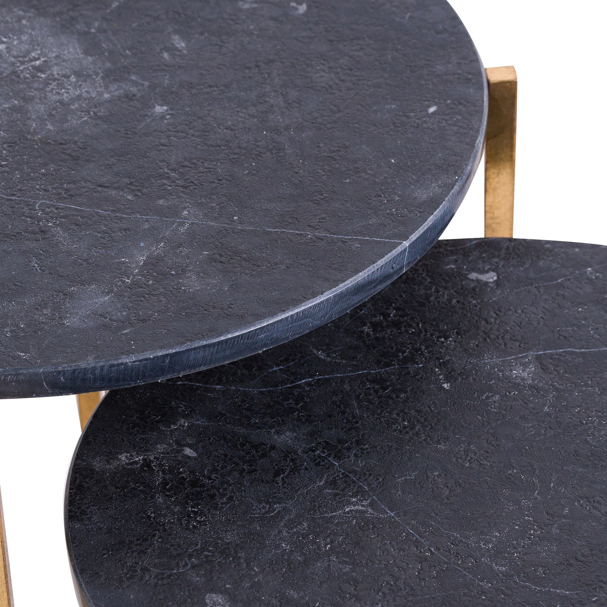 Close-up of Hill Interiors Set of 2 Gold and Black Marble-Effect Side Tables, showing the veined black stone-effect tops and gold-toned metal frames.