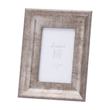 Hill Interiors Convex Matt Silver Photo Frame with a wooden base and softly rounded silver profile, holding a 4x6 portrait insert, on a white background.