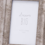 Hill Interiors Convex Matt Silver Photo Frame with wooden base and 4x6 aperture displaying a Dream Big insert, shown in close-up detail.