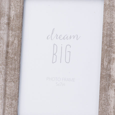 Close-up of the Hill Interiors Convex Matt Silver 5x7in photo frame, showing its wood body with weathered silver finish around a "dream big" insert.