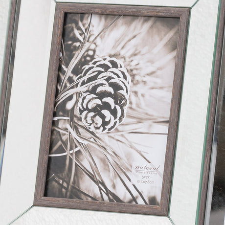Hill Interiors 5x7in photo frame with brown wooden surround and mirrored border, displaying a black and white pinecone image in portrait.