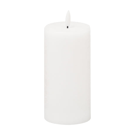 Hill Interiors Natural Glow LED wax pillar candle in beige, 15cm tall with a textured finish and flickering LED flame tip, shown on a plain white background.
