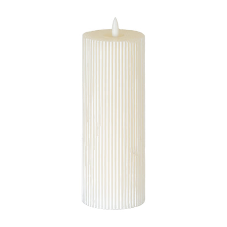 Hill Interiors Textured Ribbed LED Pillar Candle in beige with vertical fluted body and flickering LED flame tip, shown against a plain white background.
