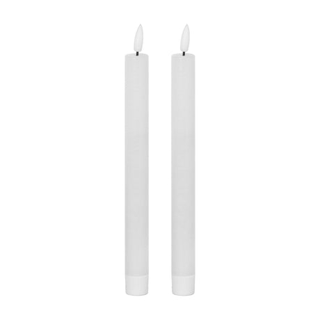 Hill Interiors Natural Glow LED dinner candles set of 2 in beige plastic with slim tapered form and flickering flame tips on a white background.