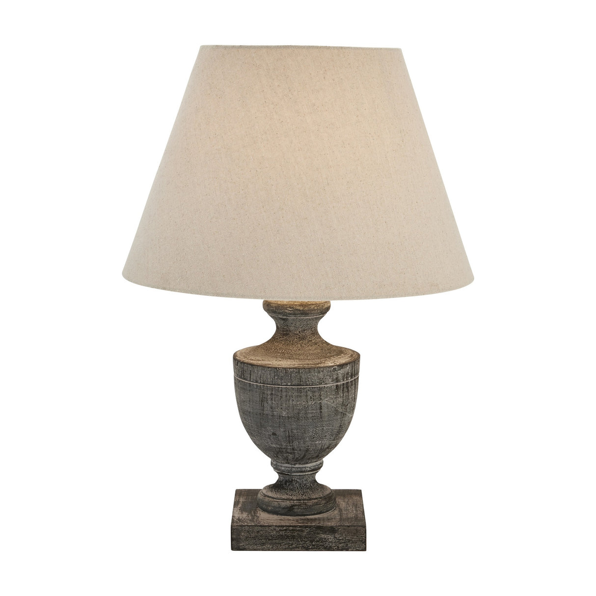 Hill Interiors Ondelle Urn Wooden Table Lamp in brown with a turned timber urn base, square plinth and tapered cream linen shade on a white background.