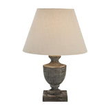 Hill Interiors Ondelle Urn Wooden Table Lamp in brown with a turned timber urn base, square plinth and tapered cream linen shade on a white background.