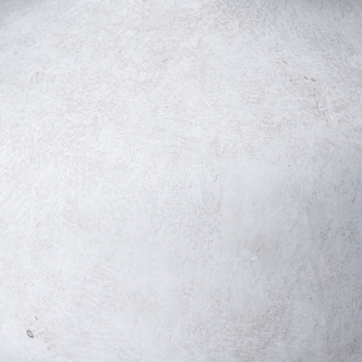 Close-up of the Hill Interiors Squat Stone Ceramic Vase in beige, showing its matte stone-effect finish and gently textured surface.
