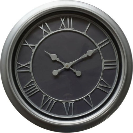 Hill Interiors Round Glass Wall Clock 59cm in silver, with Roman numerals and ornate hands on a dark face behind a slim silver frame.