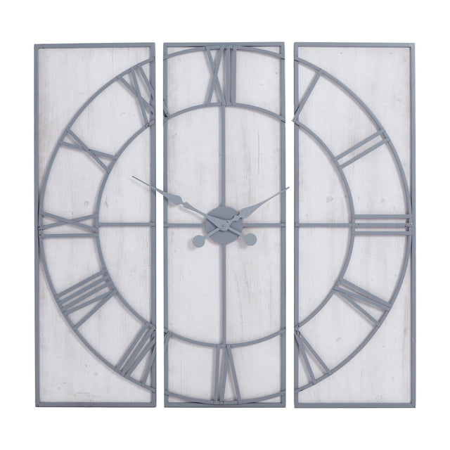 Hill Interiors Panelled Metal Wall Clock in silver, three-panel design with open Roman numeral dial and central hands on a plain background.
