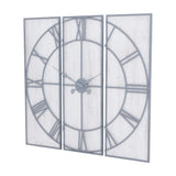 Hill Interiors Panelled Metal Wall Clock in silver, three-panel design with open Roman numeral dial and central hands, shown at an angle on white.
