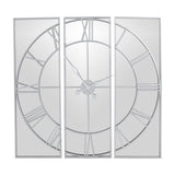 Hill Interiors Mirrored Round Wall Clock 112cm in silver, a three-panel mirrored glass design with Roman numerals and sweeping hands on a plain background.