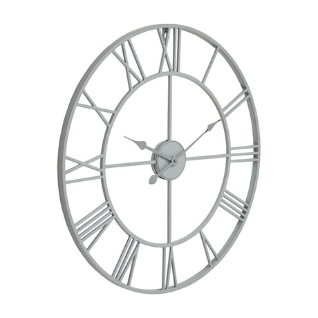 Hill Interiors Skeleton Wall Clock in grey, a round metal frame with open cut-out Roman numerals and slim hands, shown at an angle on a white background.