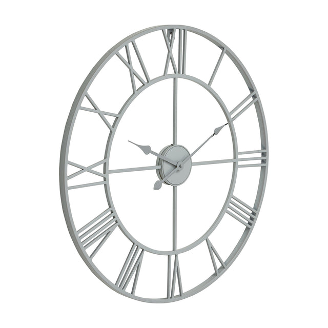 Hill Interiors Skeleton Wall Clock in grey, a round metal frame with open cut-out Roman numerals and slim hands, shown at an angle on a white background.