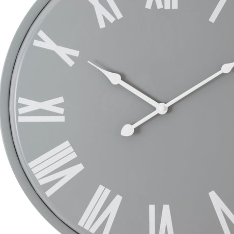 Hill Interiors 49cm metal wall clock in grey with white Roman numerals and slim white hands, shown at an angled close-up against a white background.