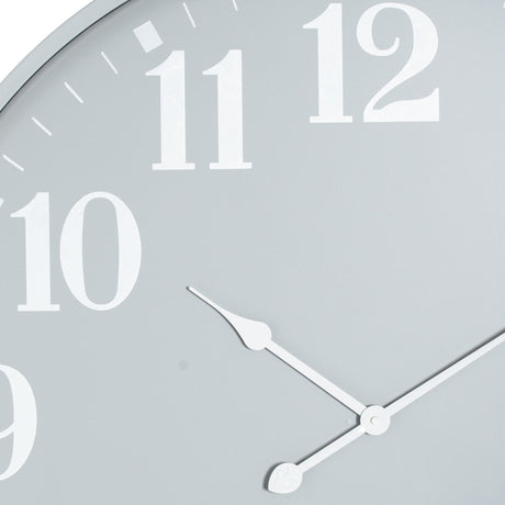 Close-up of Hill Interiors Large Metal Wall Clock in grey, showing white numerals 9 to 12 and slim white hour and minute hands on the open metal face.