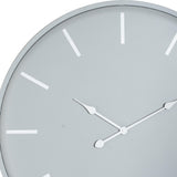 Close-up of Hill Interiors Large Round Metal Wall Clock in grey, showing slim white hands and rectangular hour markers on a pale dial.