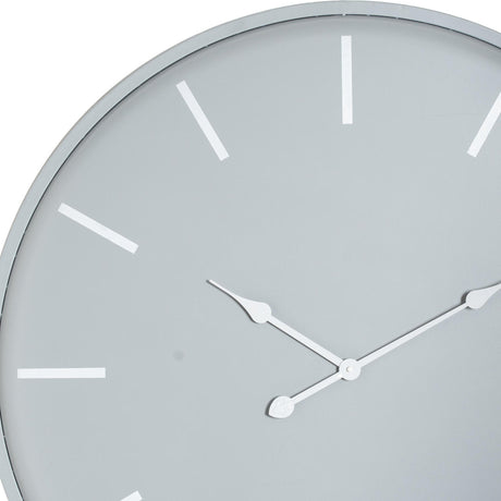 Close-up of Hill Interiors Large Round Metal Wall Clock in grey, showing slim white hands and rectangular hour markers on a pale dial.