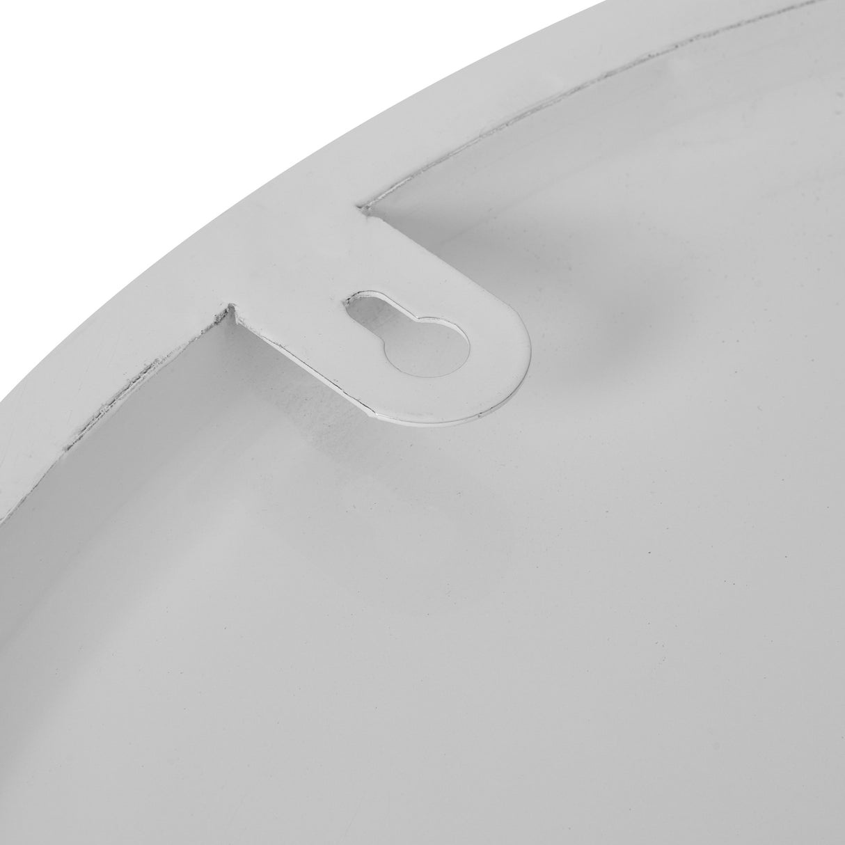Close-up of the reverse of the Hill Interiors Round Metal Wall Clock in white, showing the keyhole hanging bracket on the metal frame.
